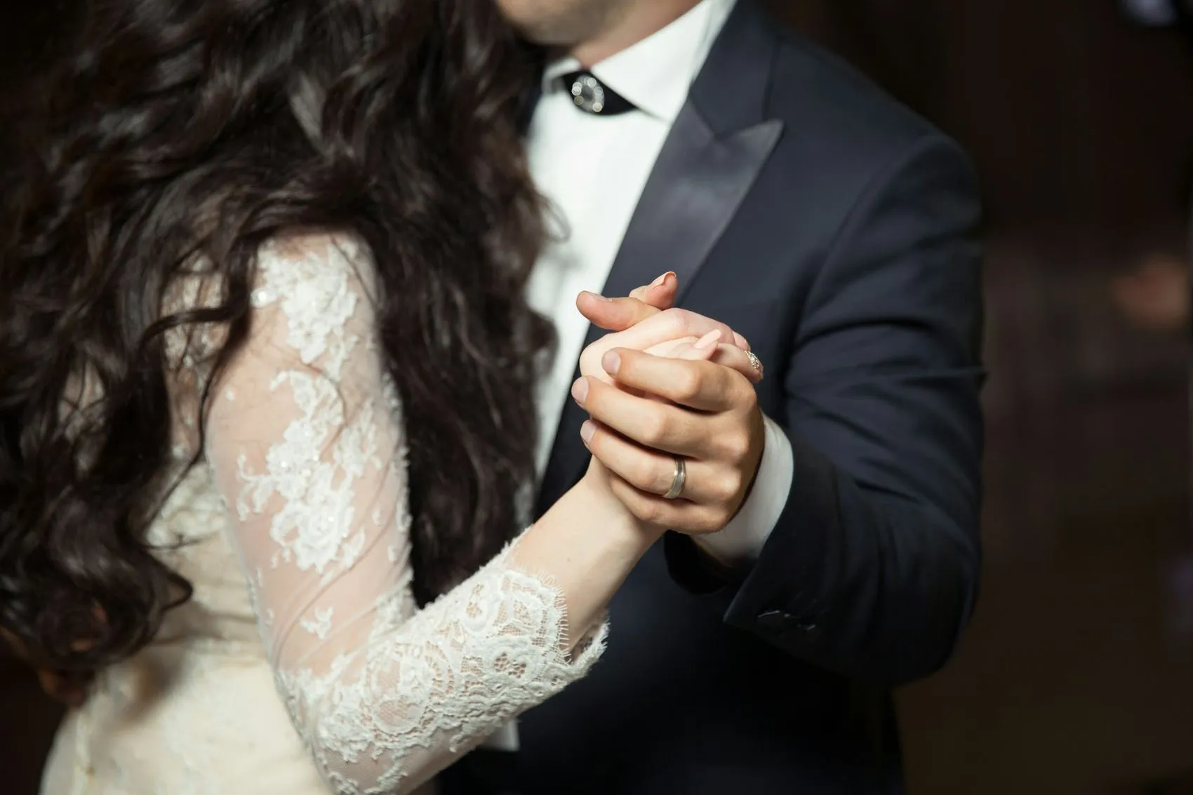 A couple's hands during the first dance