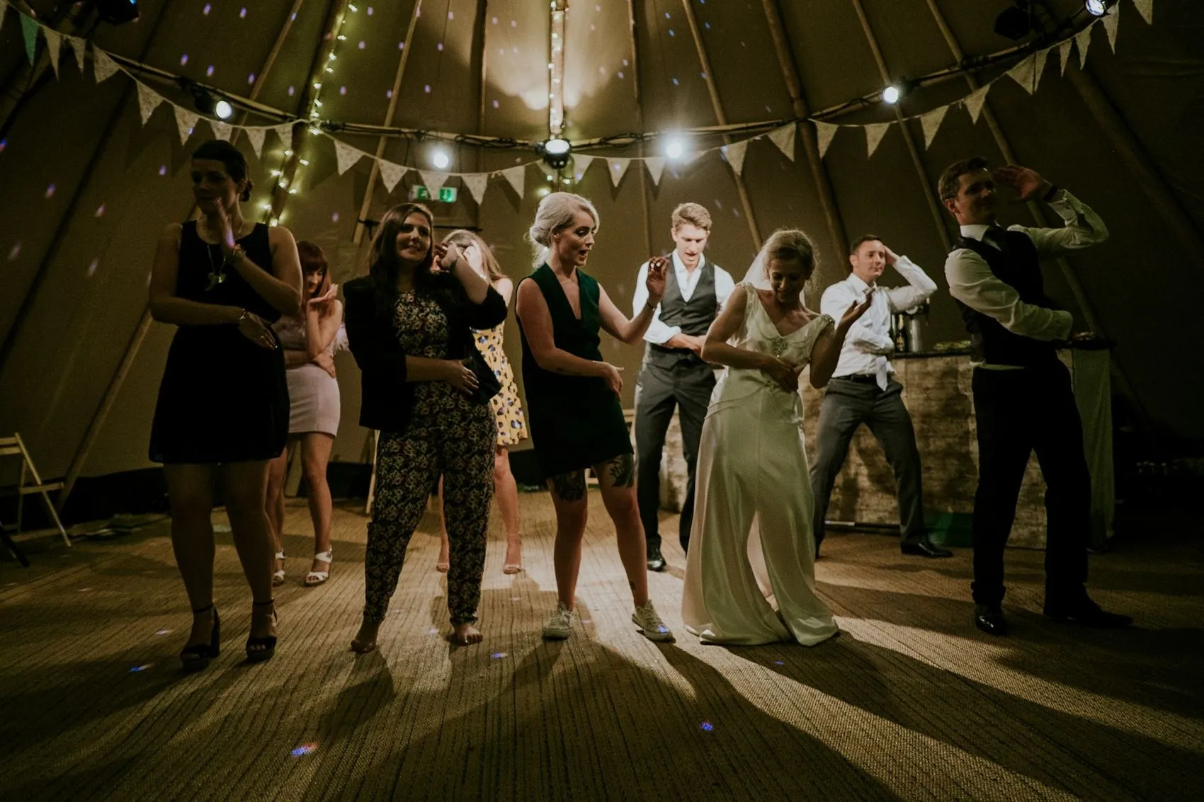 A reception under strings of warm lights