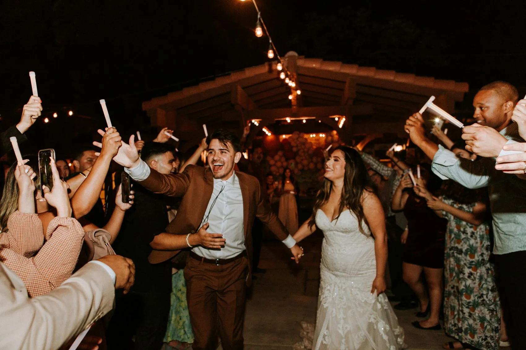 Guests holding sparklers on the dance floor